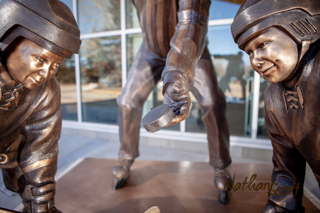 the face off hockey pee wee Servus Arena in Red Deer Alberta bronze sculpture